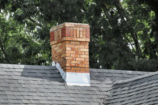 Two-tone brick chimney with new flashing